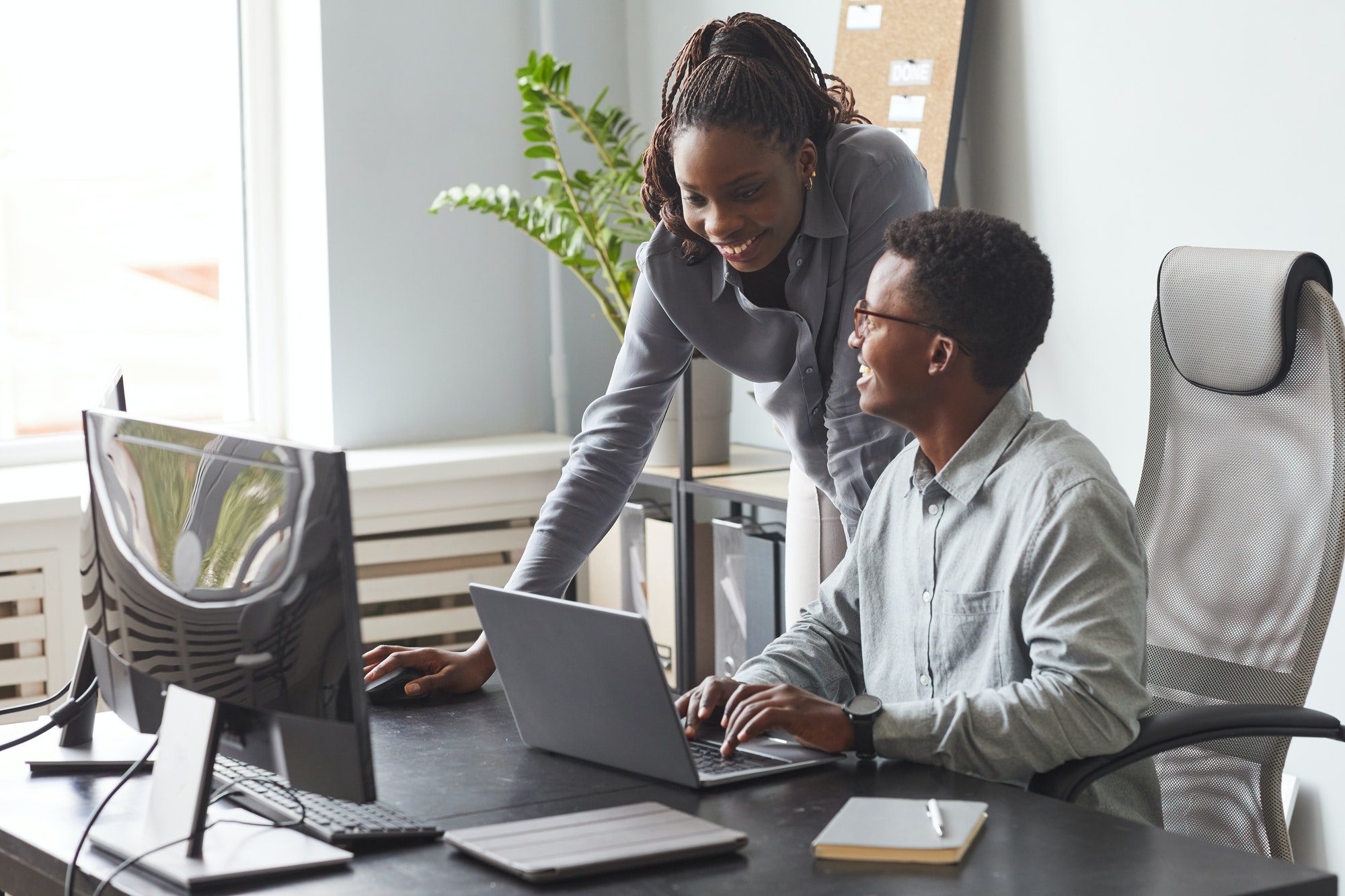 Two African American People Working in Office Together